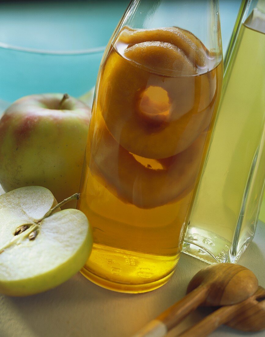 A Bottle of Apple Juice; Fresh Apples