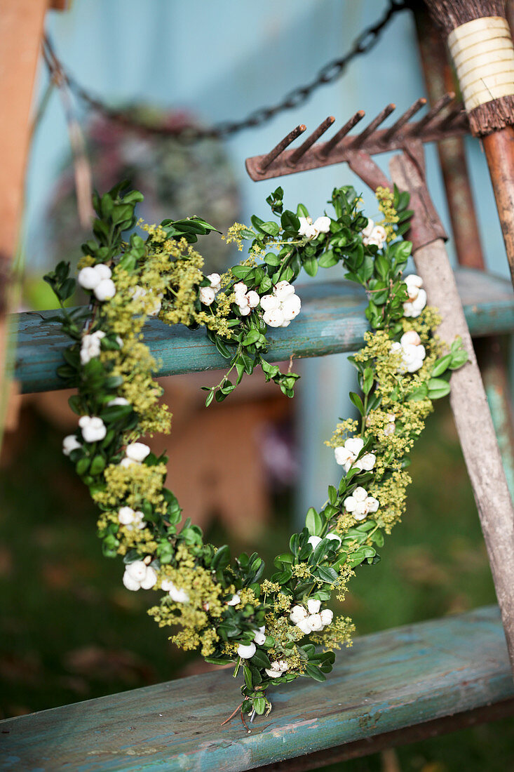 Heart of boxwood, hydrangea blossoms, and lady's mantle