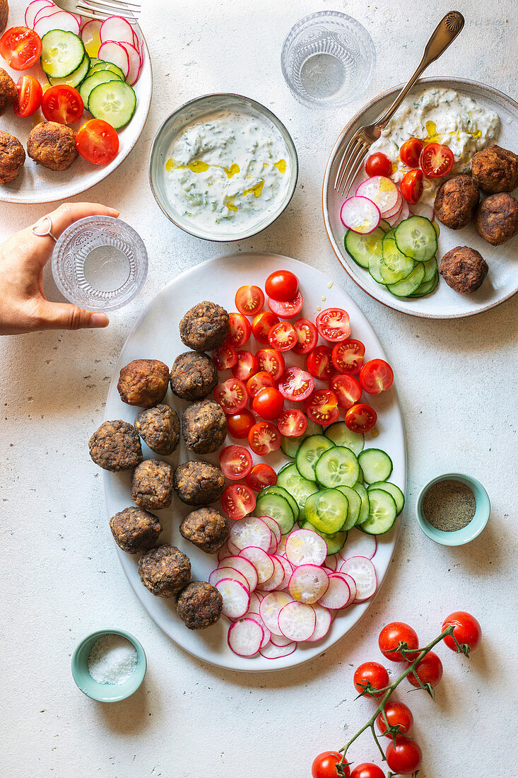 Vegetarian meatballs with tzatziki sauce and vegetables