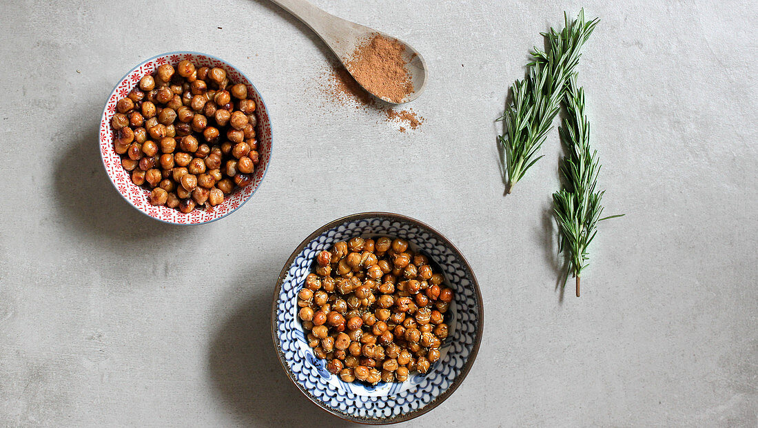 Two bowls of roasted chickpeas with sea salt and honey
