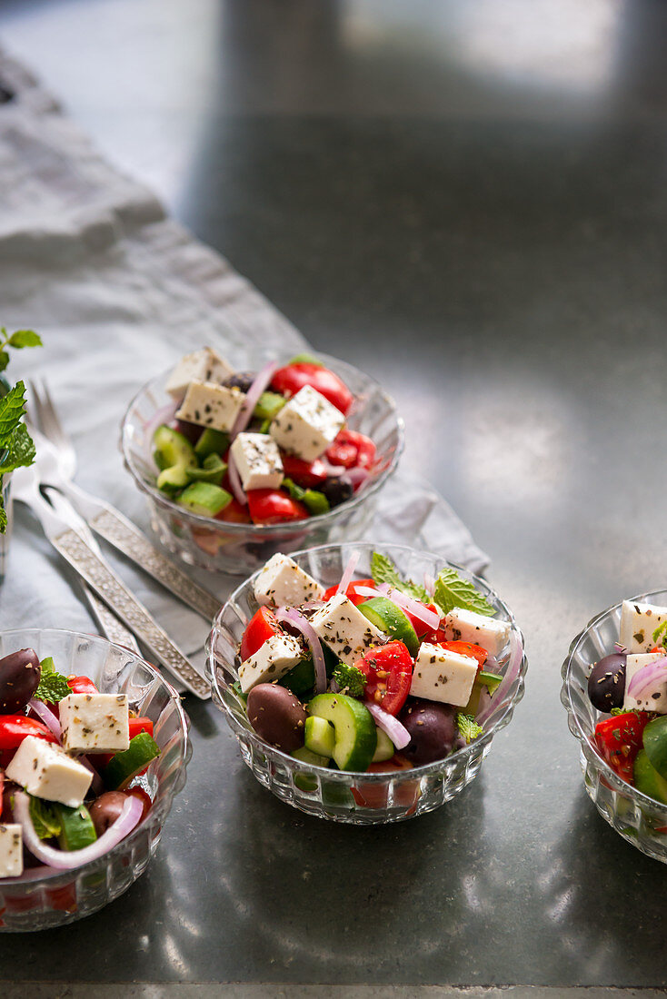 Traditional Greek salad in small glass bowls