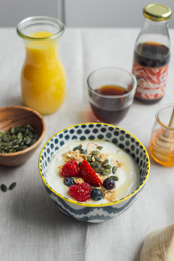 Breakfast of yogurt with granola and fresh fruit