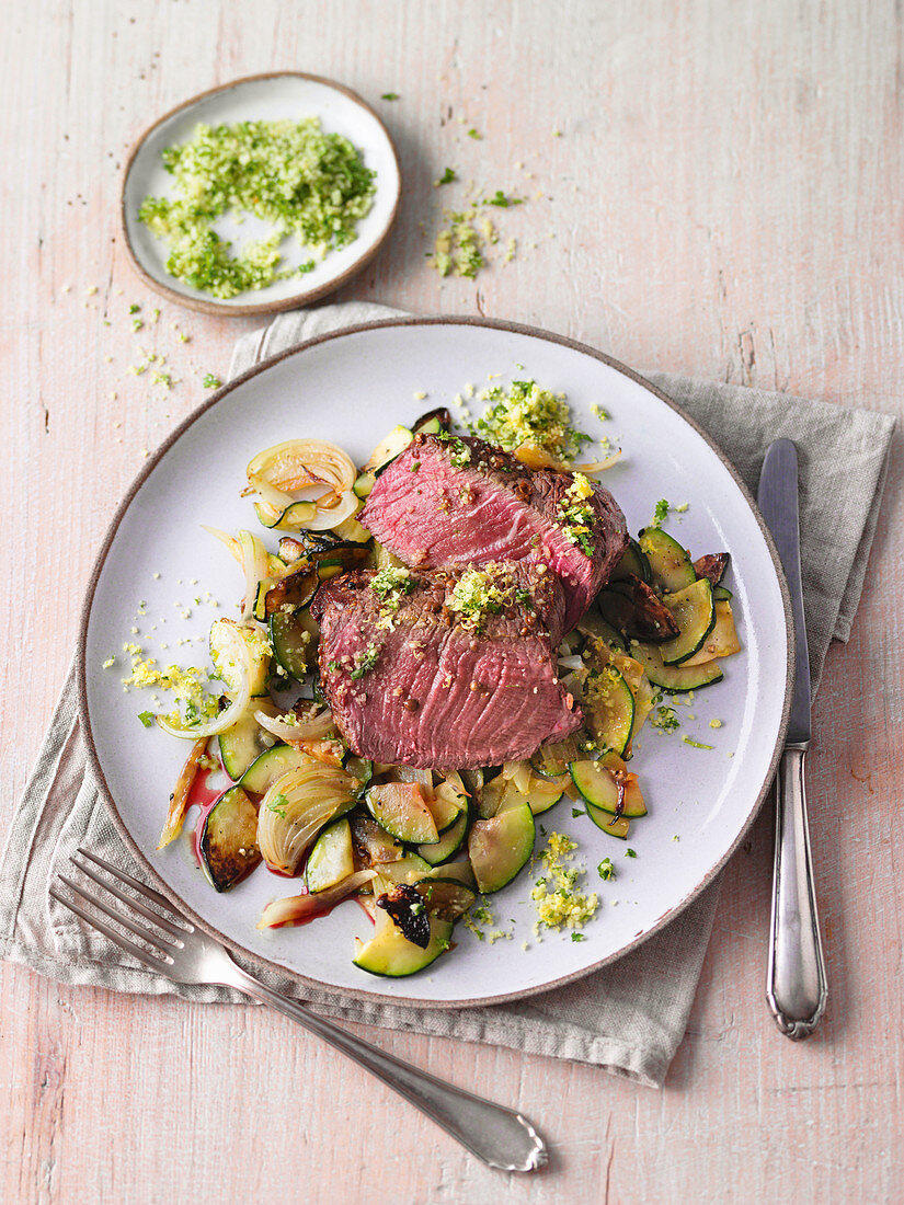 Fillet of beef with lemon and herb gremolata and courgette salad
