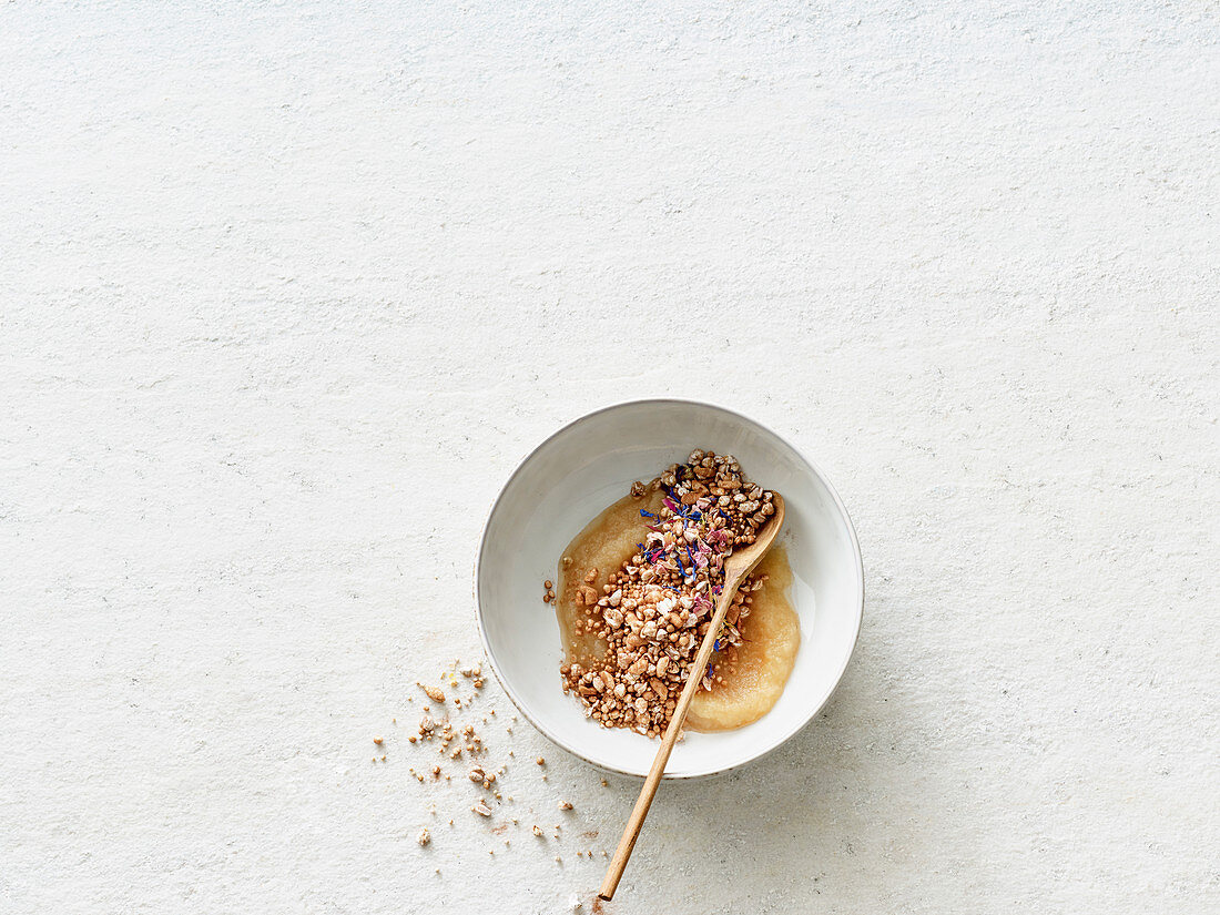 Apple puree with cereal pops and raw cacao