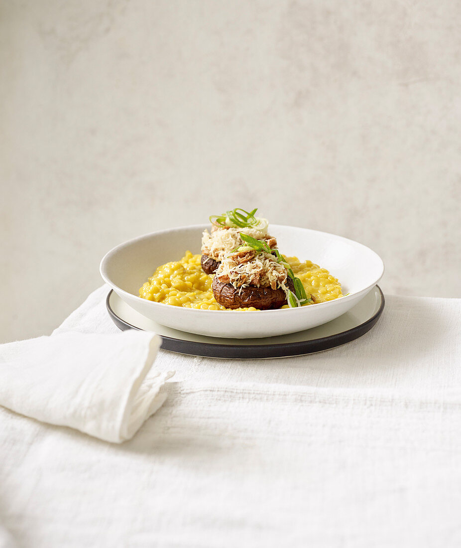 Stuffed mushrooms on turmeric lentils