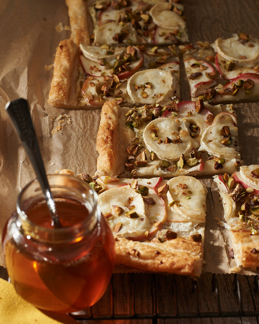 Pizza with goat’s cheese, nuts and honey