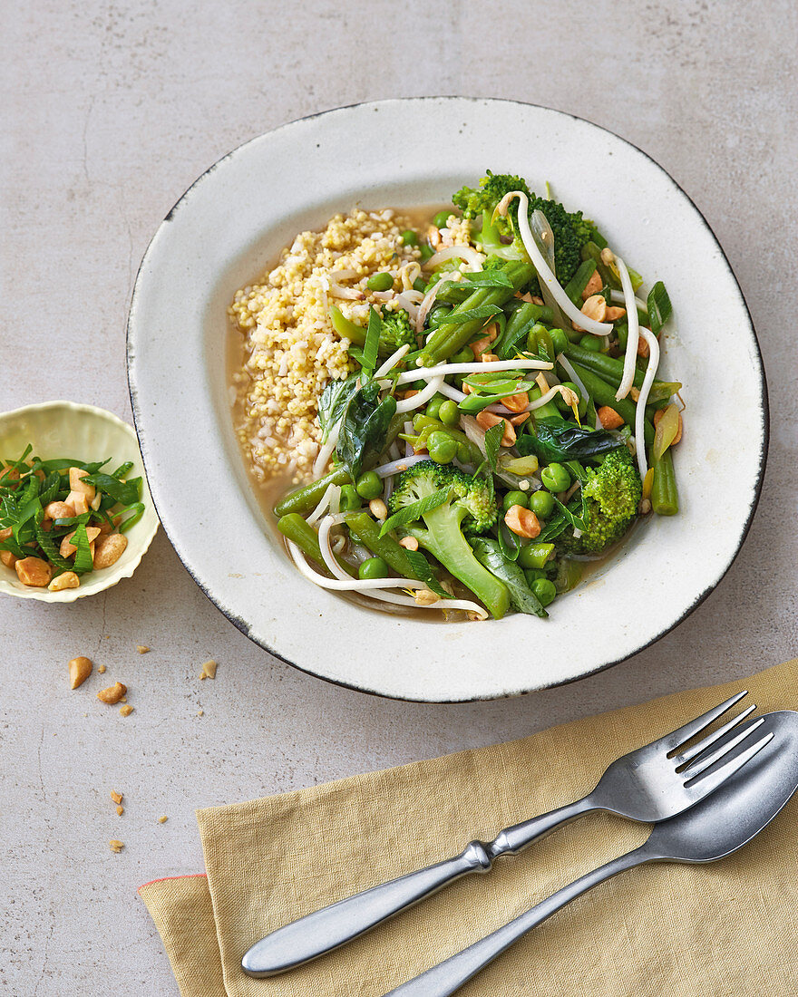 Vegan vegetable curry with coconut millet and sprouts