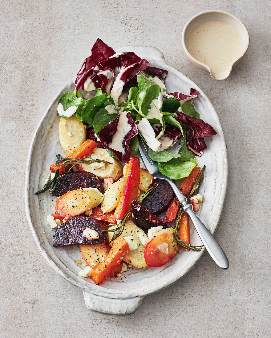 Root vegetables on a tray with feta