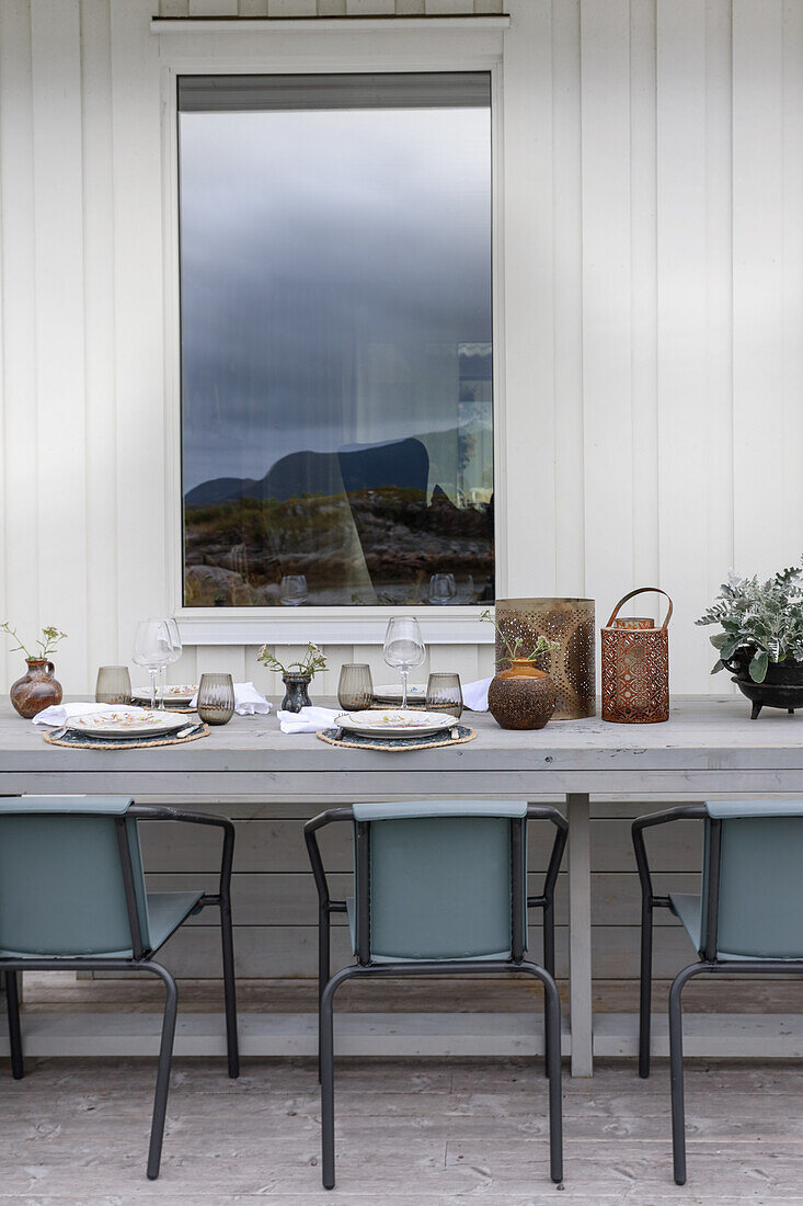 Set wooden table and chairs on terrace