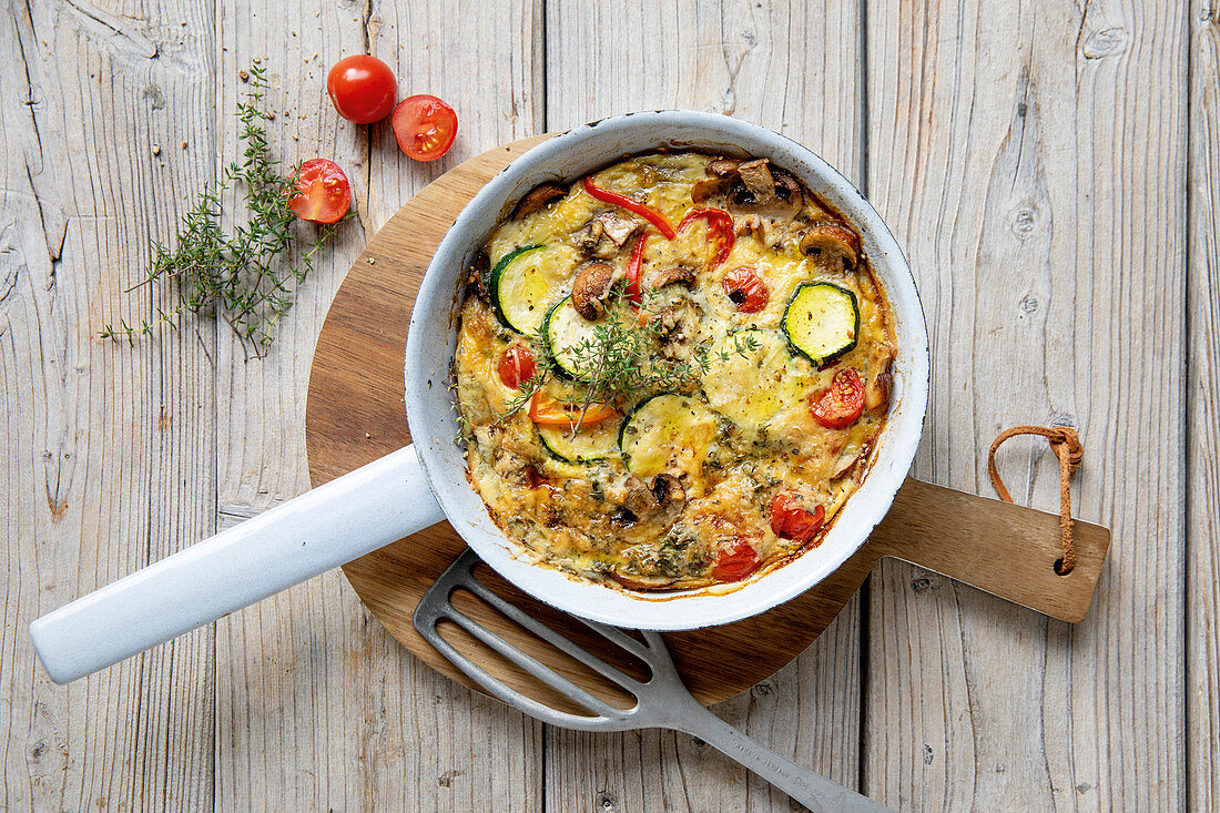 Colourful vegetable frittata with courgettes, mushrooms and tomatoes