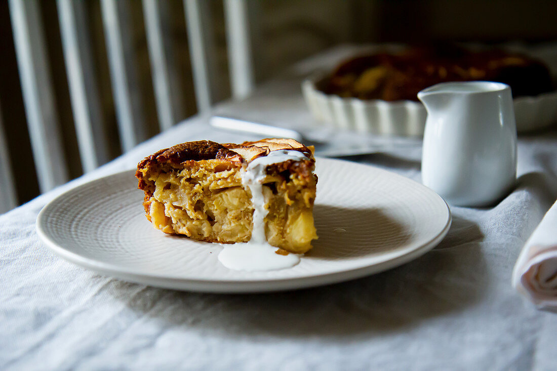 A slice of Torta di Mele (apple pie) on a kitchen table