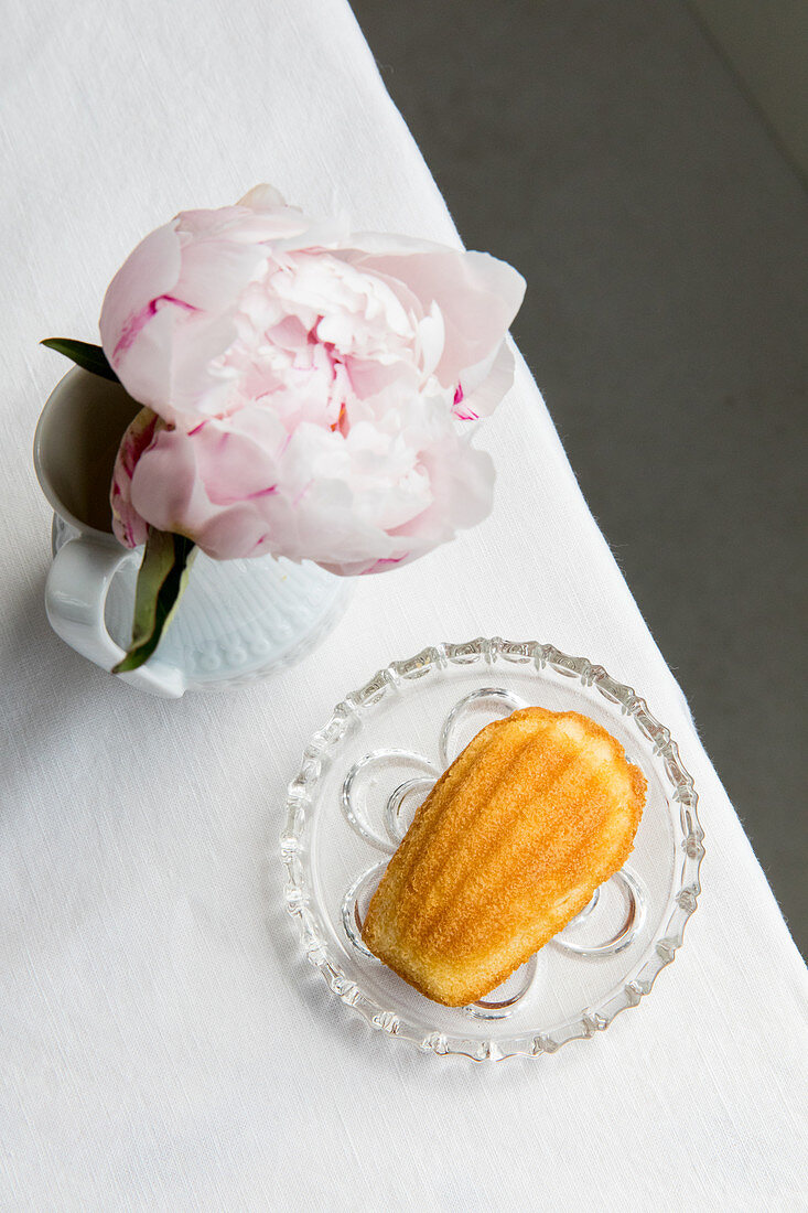 Madeleines and a vase of peonies