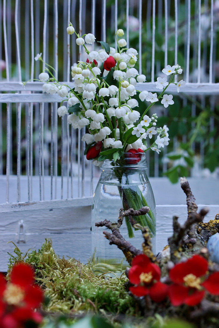 Bouquet of lily-of-the-valley, lady's smock and Japanese quince