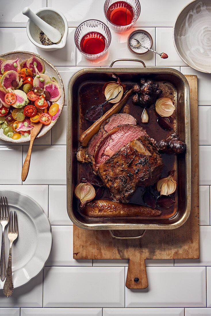 Entrecote roast served with salad with grapes, watermelon radish and tomatoes