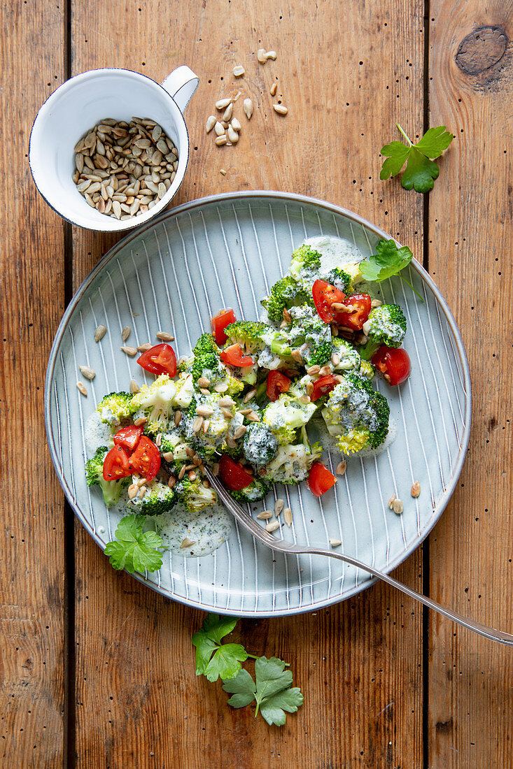 Broccoli salad with cherry tomatoes and sunflower seeds