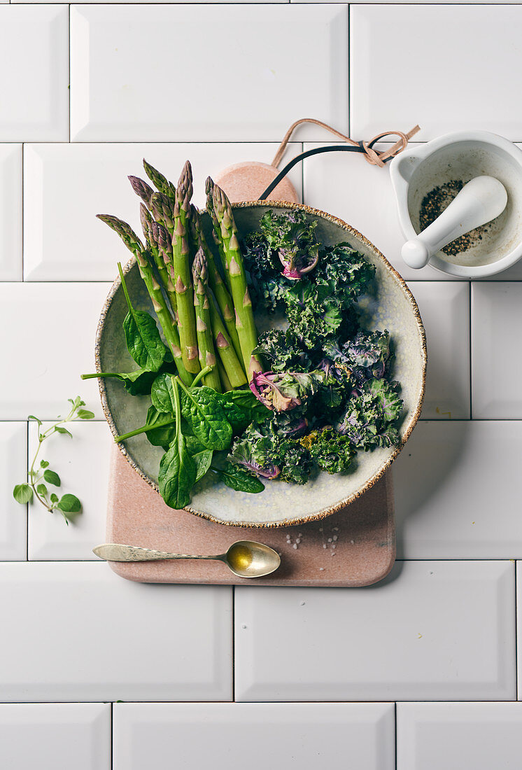 Mini asparagus, Flower Sprouts and spinach in a ceramic bowl