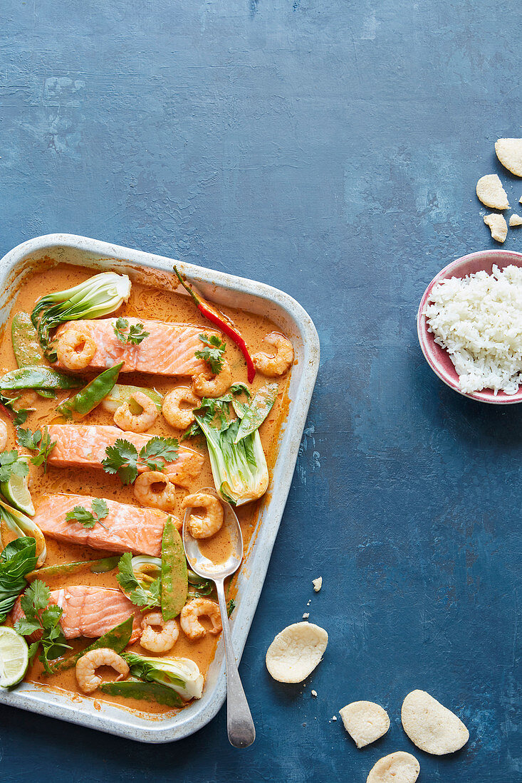 Fragrant coconut, salmon and prawn traybake