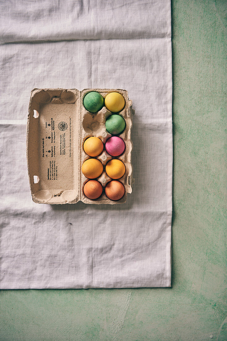 Colorful Easter eggs in an egg carton