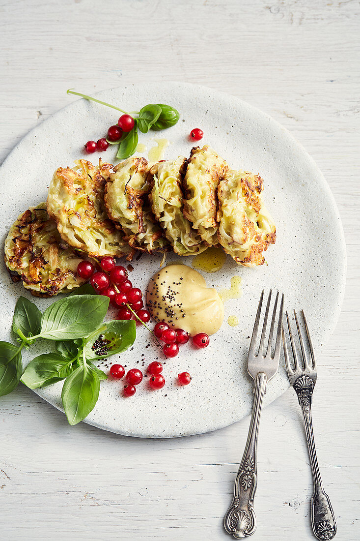 Vegetarian pointed cabbage and apple fritters with hot mustard