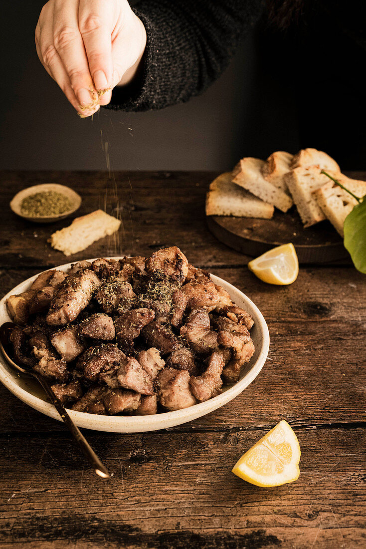 Fried meat with oregano