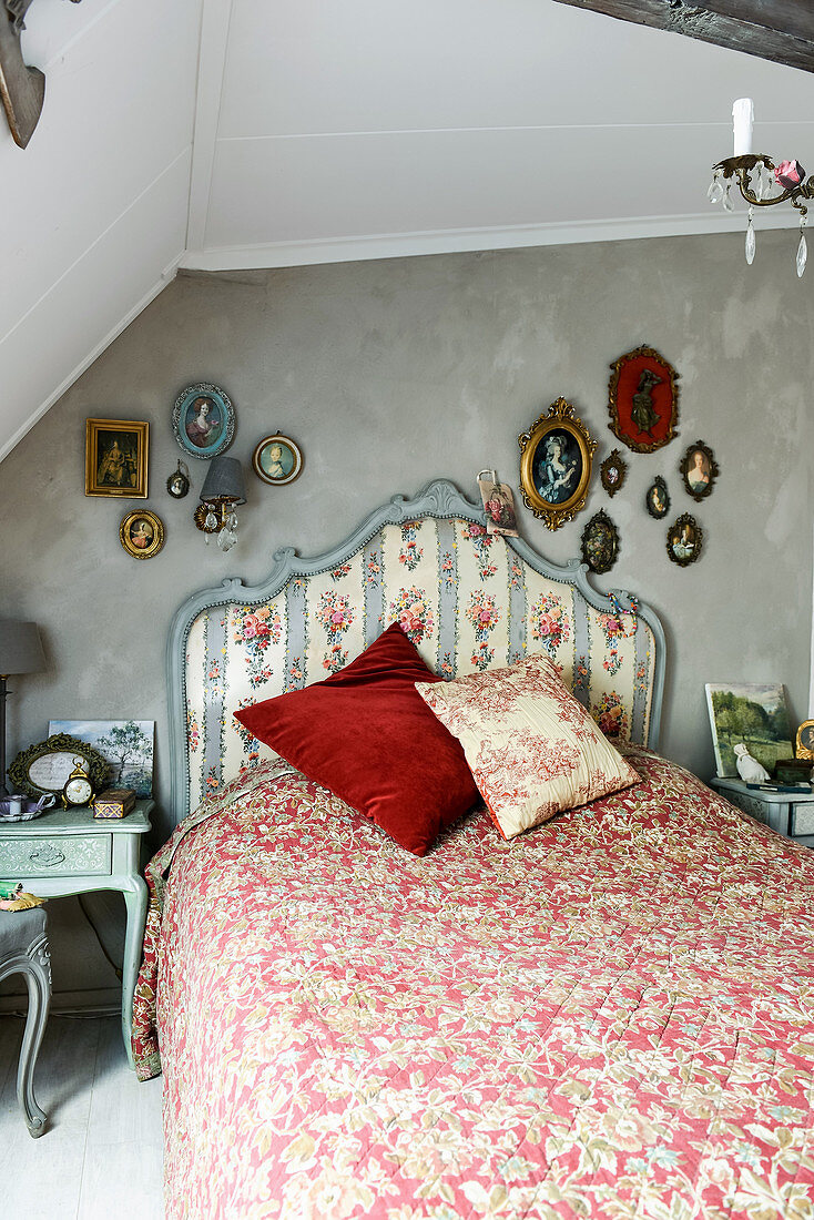 Bed with pretty headboard in vintage-style bedroom