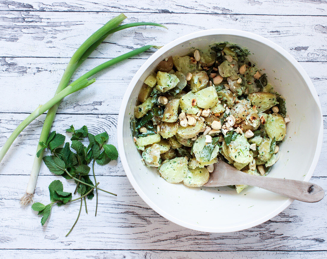 A vegan potato salad made with soya yoghurt and cashew nuts