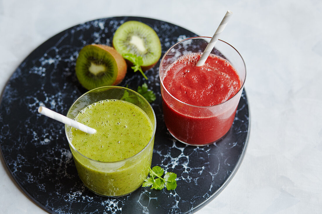 Beetroot and carrot smoothie, and a parsley and kiwi smoothie