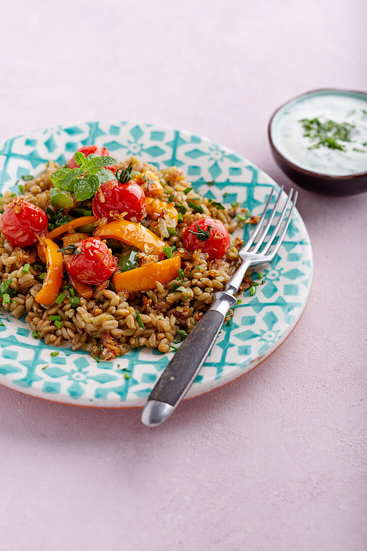 Fried freekeh with vegetables and mint yoghurt