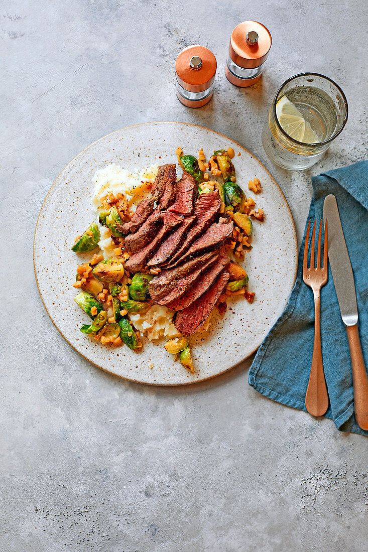 Venison steaks with stir-fried sprouts