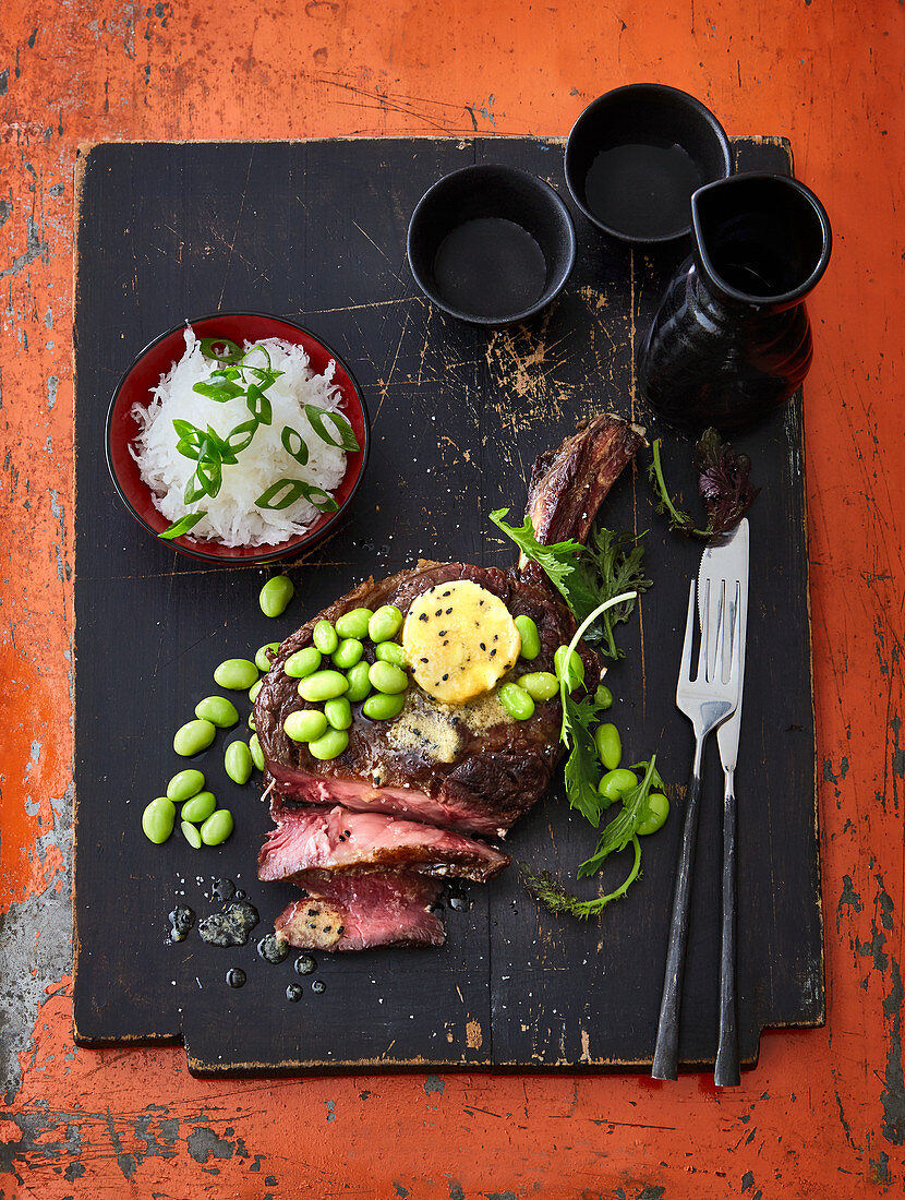 Tomahawk steak with miso butter and edamame