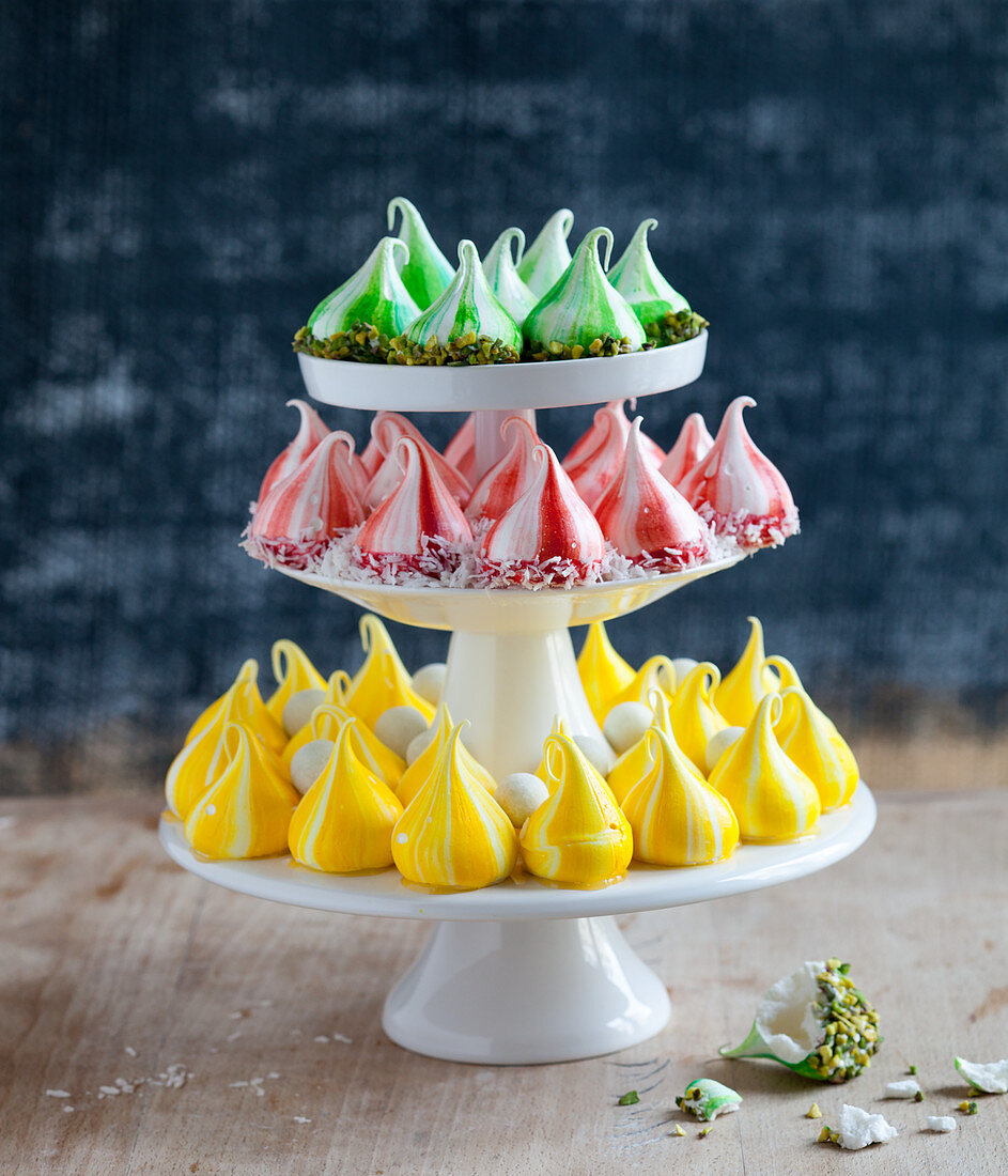 Tricolor meringue drops on a cake stand