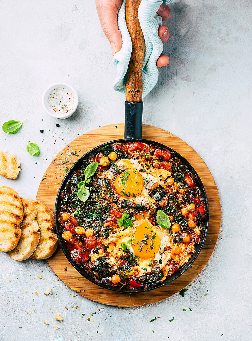 Shakshuka with chickpeas, spinach, and egg