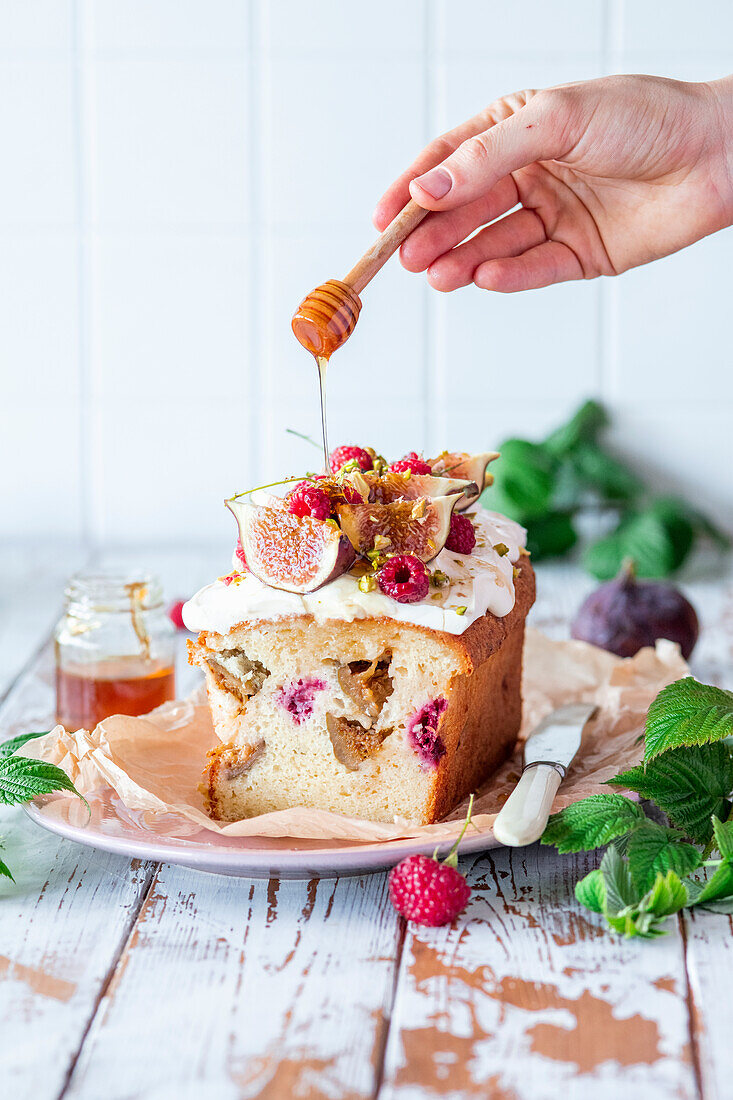 Fig and raspberry cake drizzled with honey