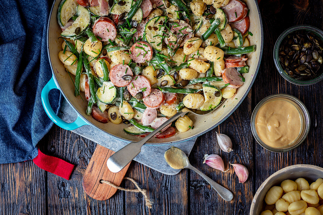 Gnocchi with sausage and veggies in mustard sauce