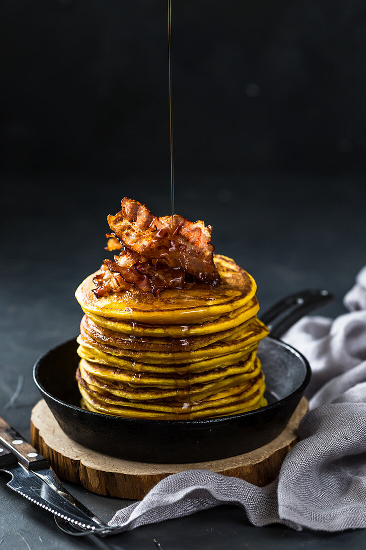 Sweet potato pancakes with crispy bacon and maple syrup