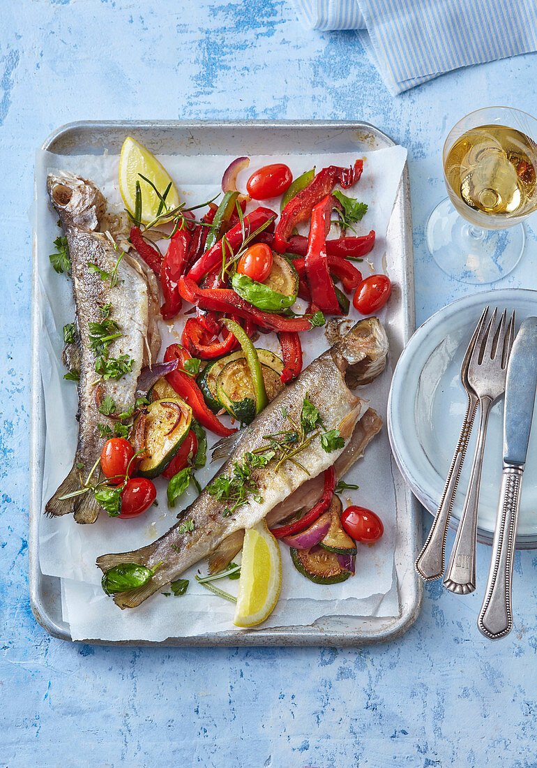 Butter trout with herbs and baked vegetables