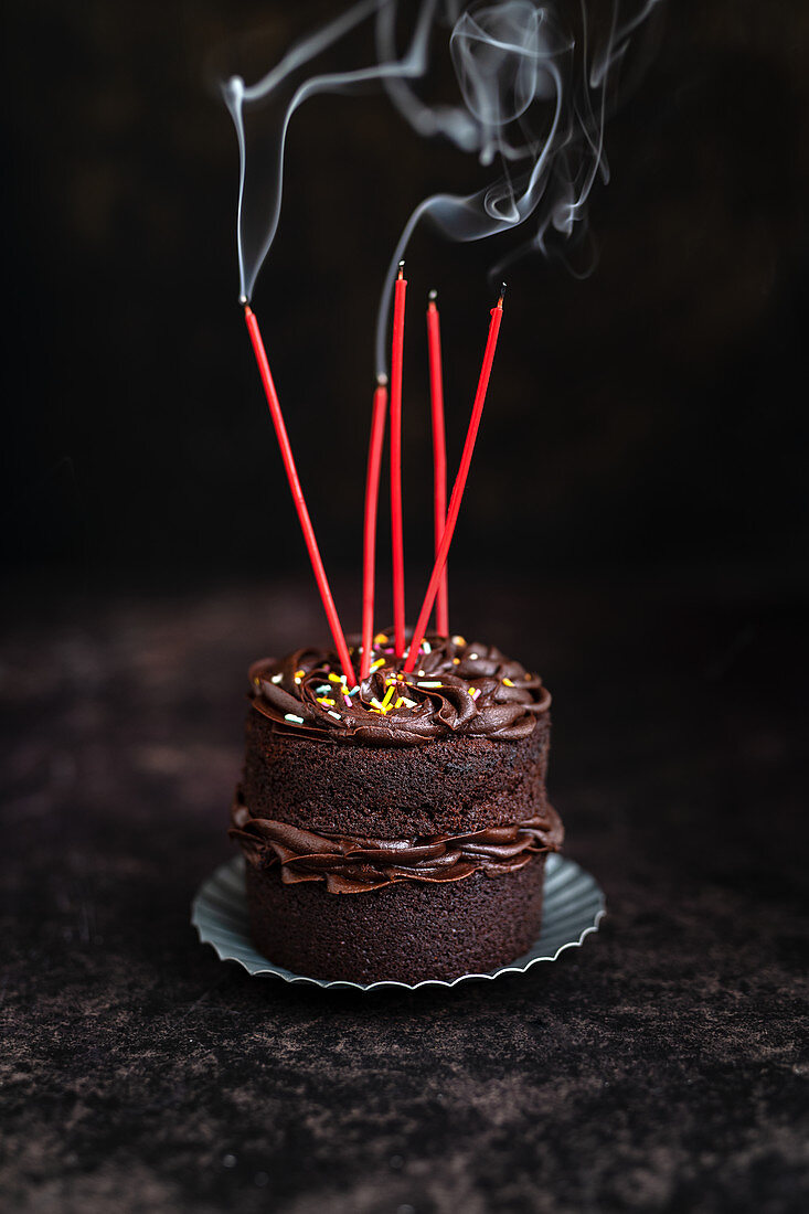 Mini chocolate cake with blown-out candles