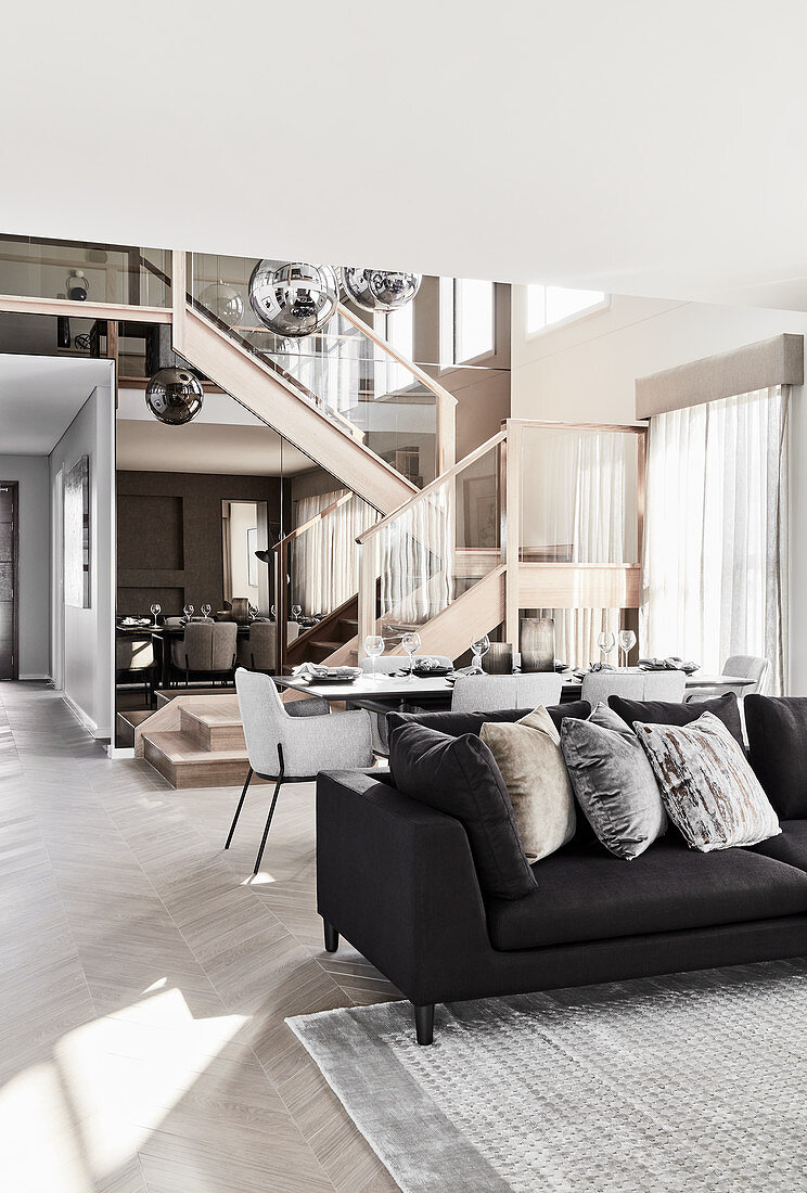 Modern multifunctional interior decorated in shades of grey