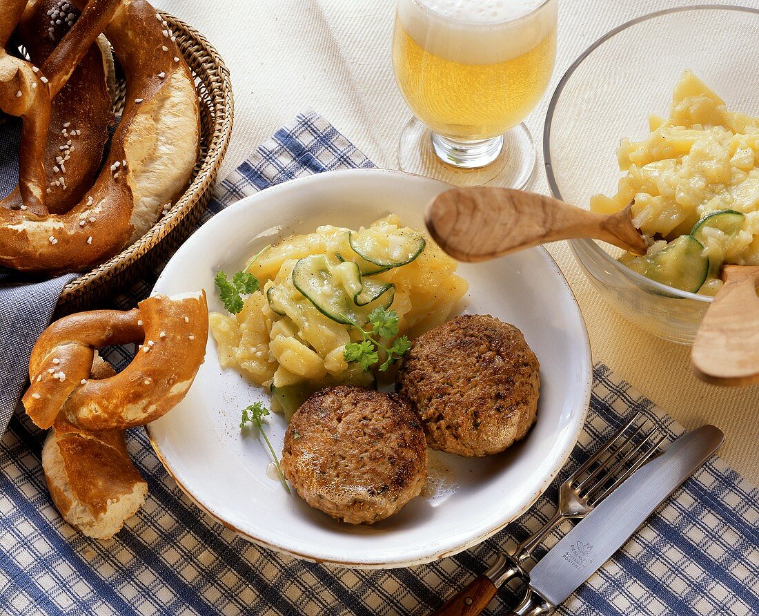Bavarian burgers with potato and cucumber salad