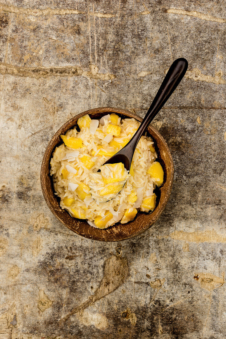 Glutinous rice with mango in a wooden bowl