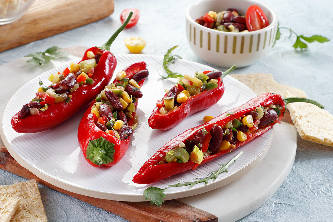 Pepper stuffed with red bean, corn and tomato salad