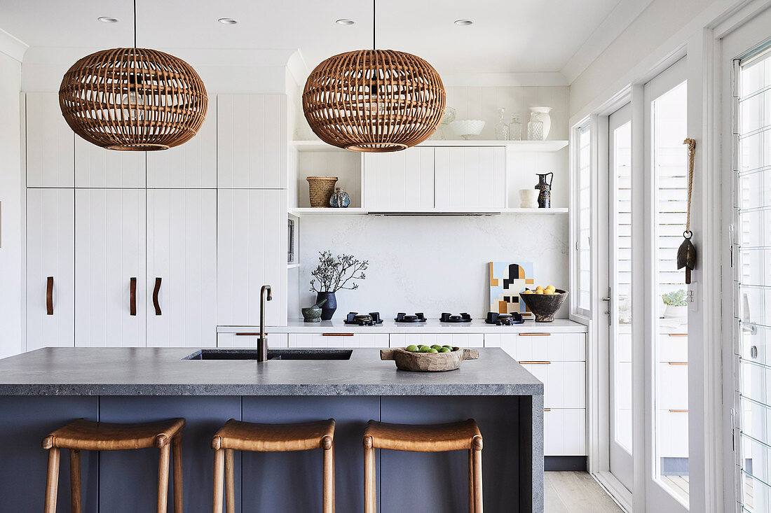 Modern kitchen in white and grey with kitchen island and bar stools