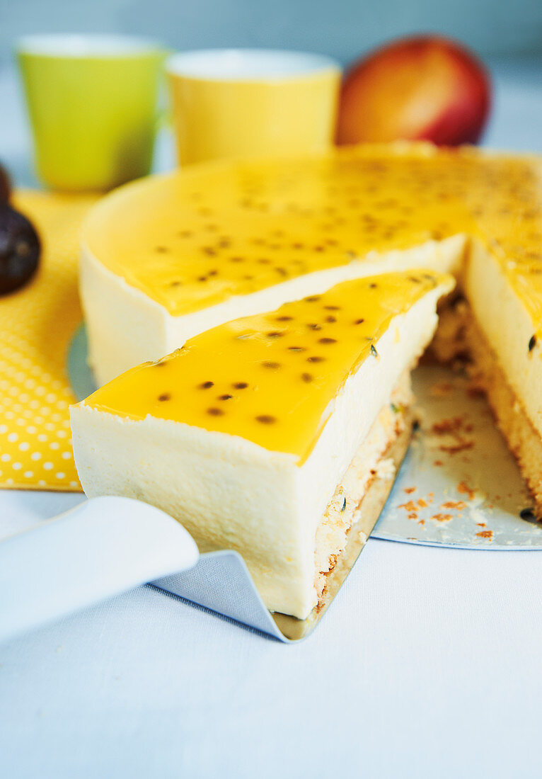 An exotic cake with coconut sponge and a passion fruit topping