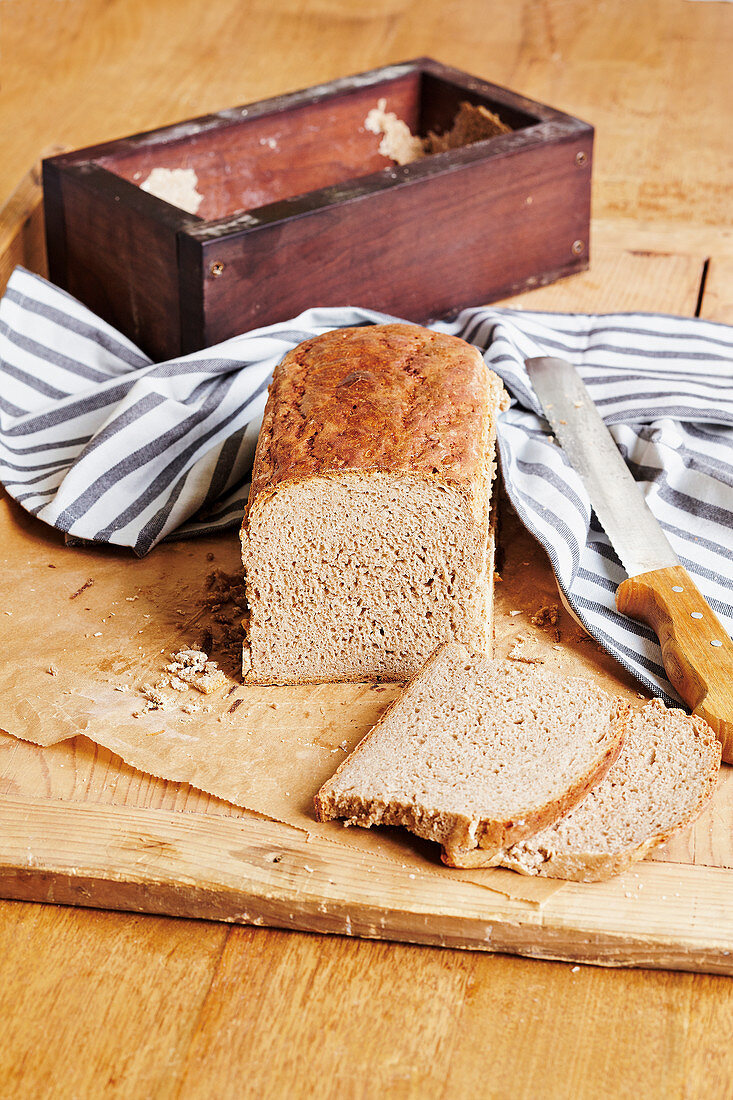 Sourdough bread in a wooden baking frame