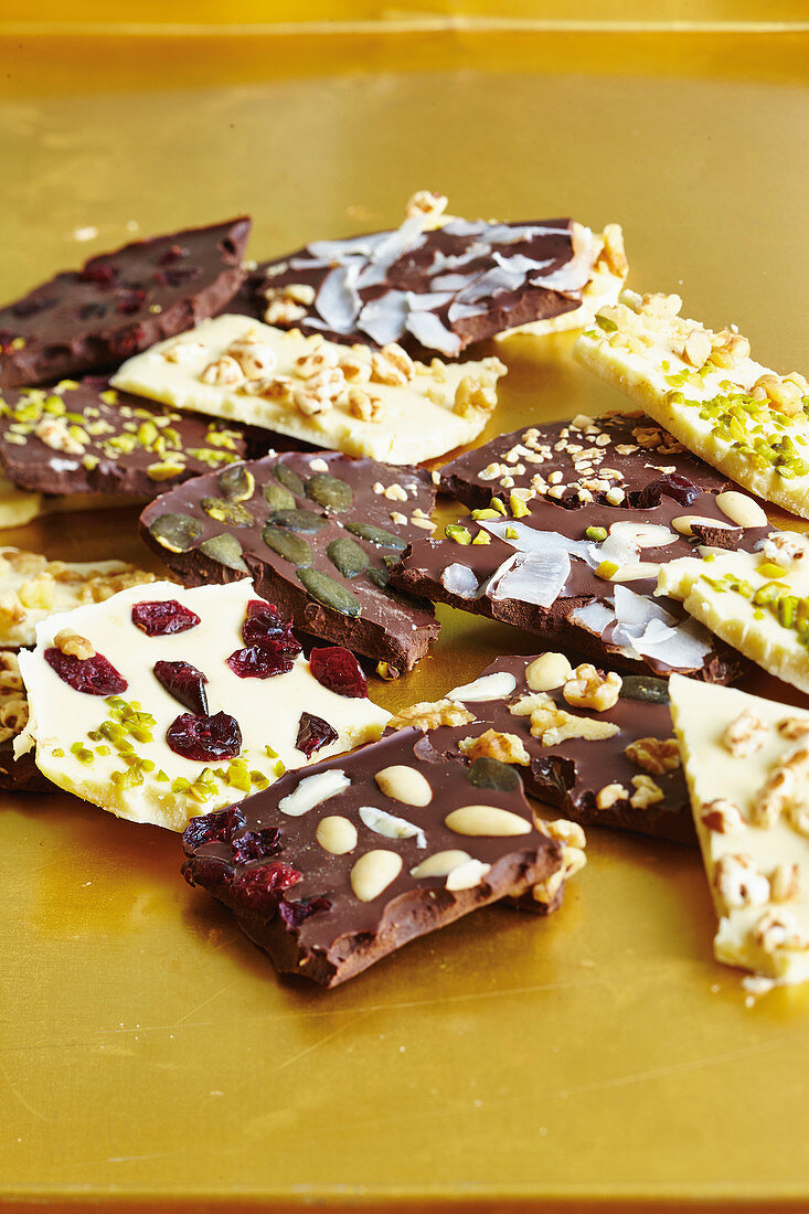 Chocolate bars with nuts, almonds and cranberries