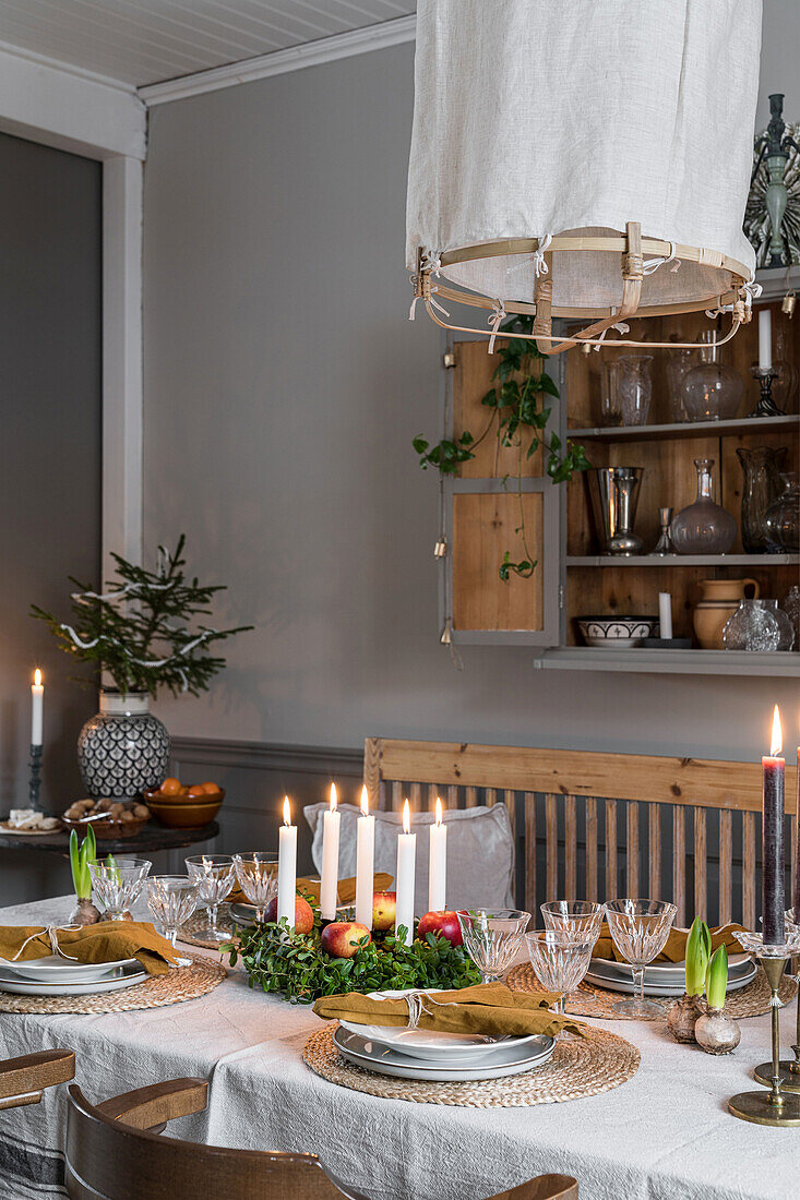 Festively set table with Advent wreath