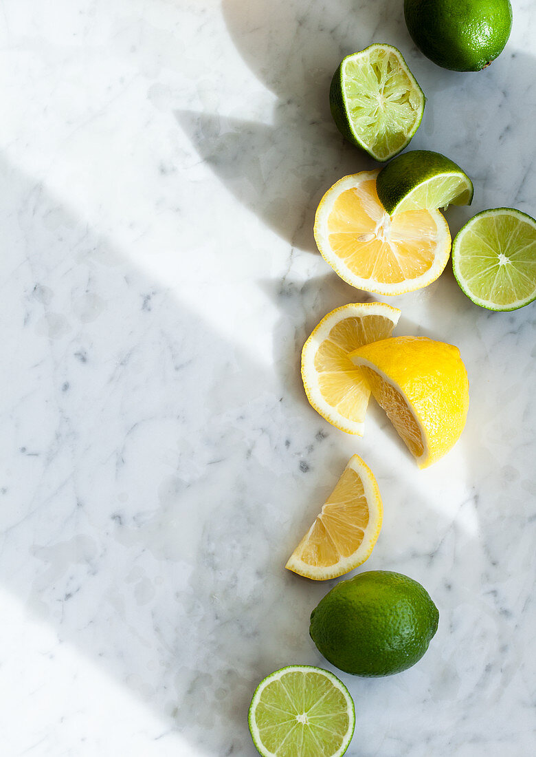 Lemons and limes, whole, halved and slices