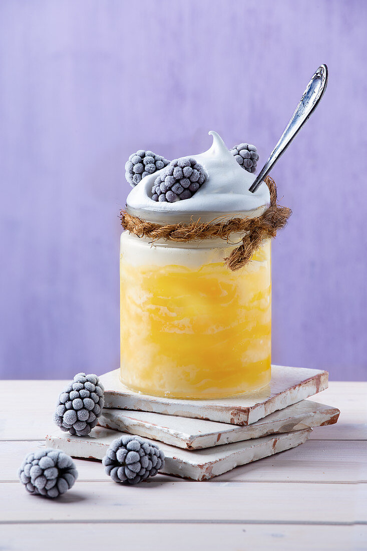 Granita di Limone with a soft meringue topping and frozen blackberries