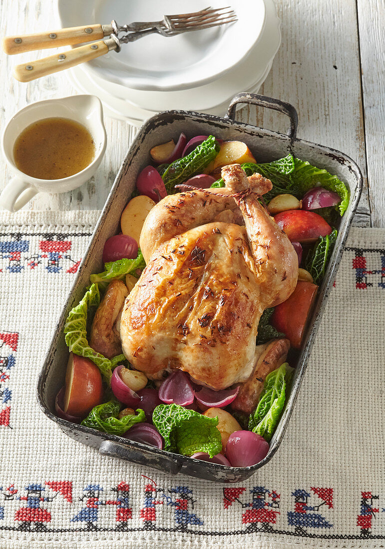 Baked chicken with vegetables and apples