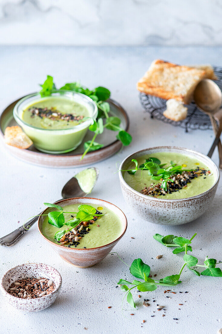Green pea soup with grain topping